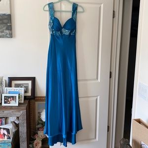 Size 4 floor length teal formal gown. Worn only once. Slight high-low hem line